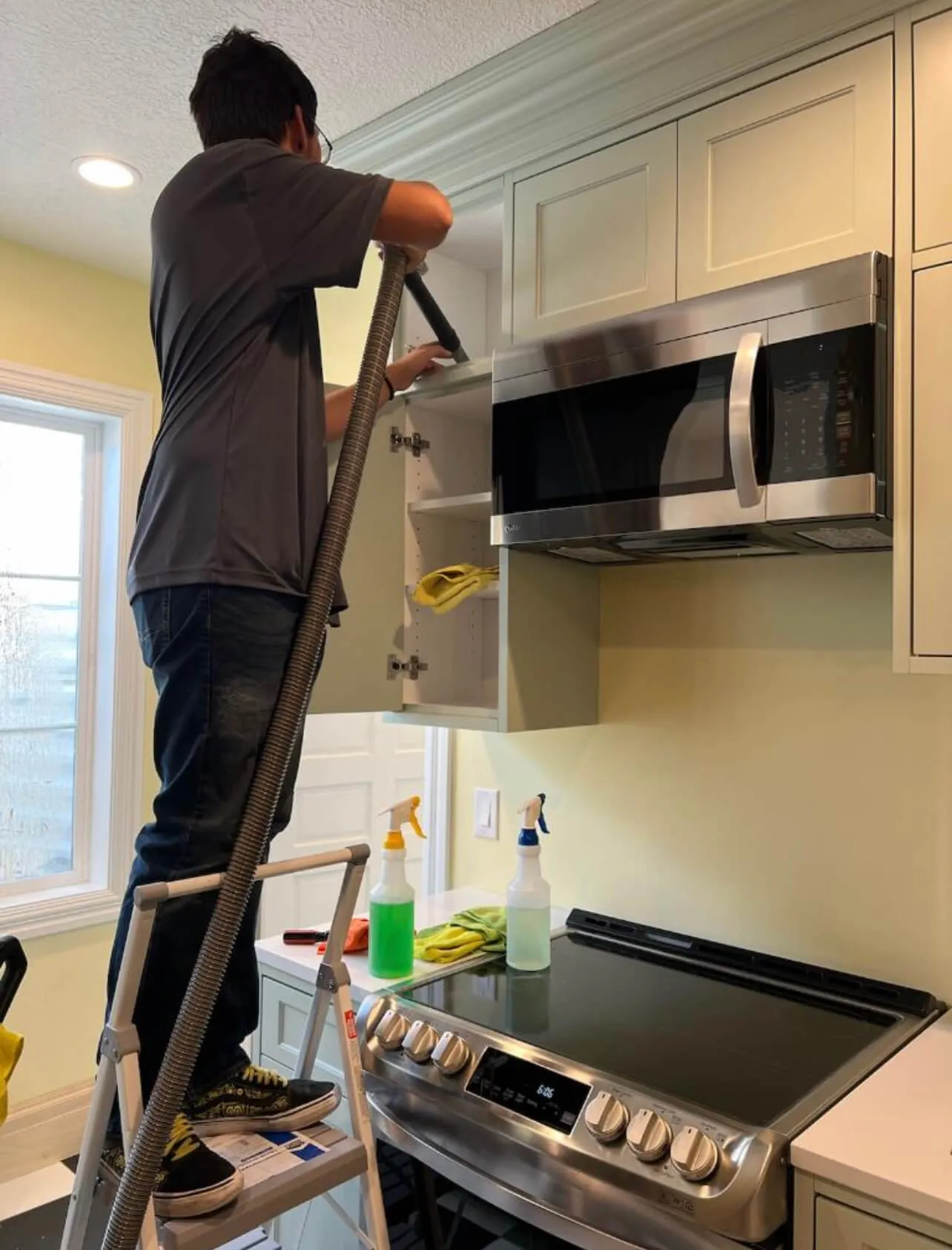 A person vacuuming dust during a post construction cleaning

