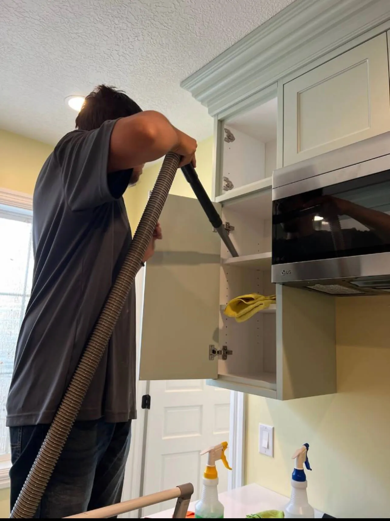 A person vacuuming dust during a post construction cleaning
